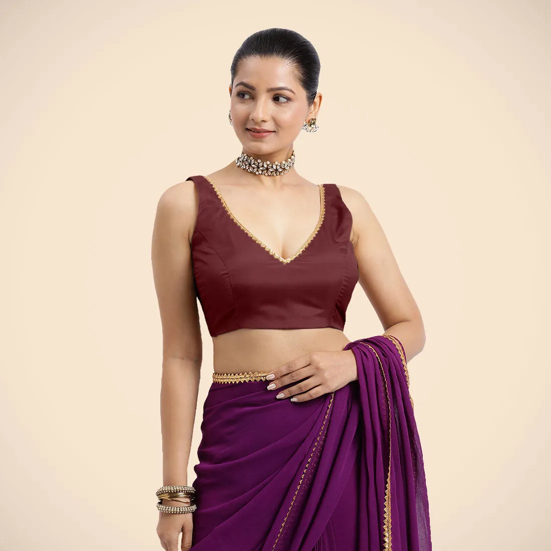 Raisa x Tyohaar | Burgundy Sleeveless FlexiFit™ Saree Blouse with V Neckline with Golden Gota Lace Embellishment and Back Cut-out with Tie-Up